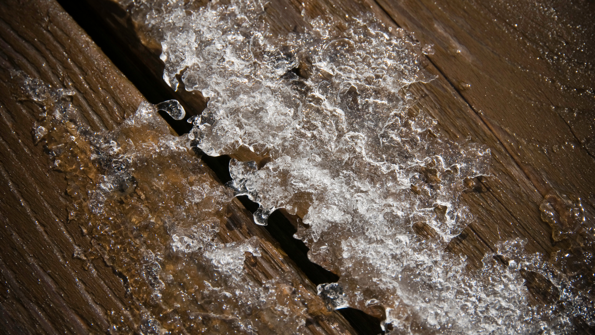 melt ice on wood deck