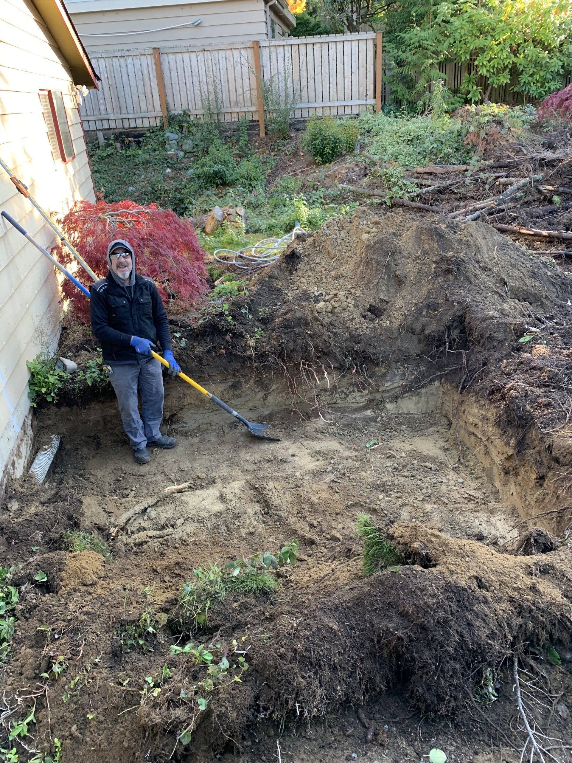 Man Digging — Snohomish, WA, — Smokey’s Tractor Werx & Excavation Inc.