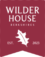 A logo for wilder house berkshires with a maple leaf