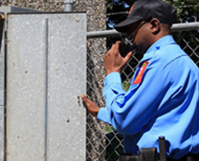 Security Guard Communicating Using A Handheld Transceiver — Elk Grove, CA — Airborne Security Patrol, Inc.