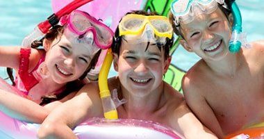 Kids smiling while at the pool