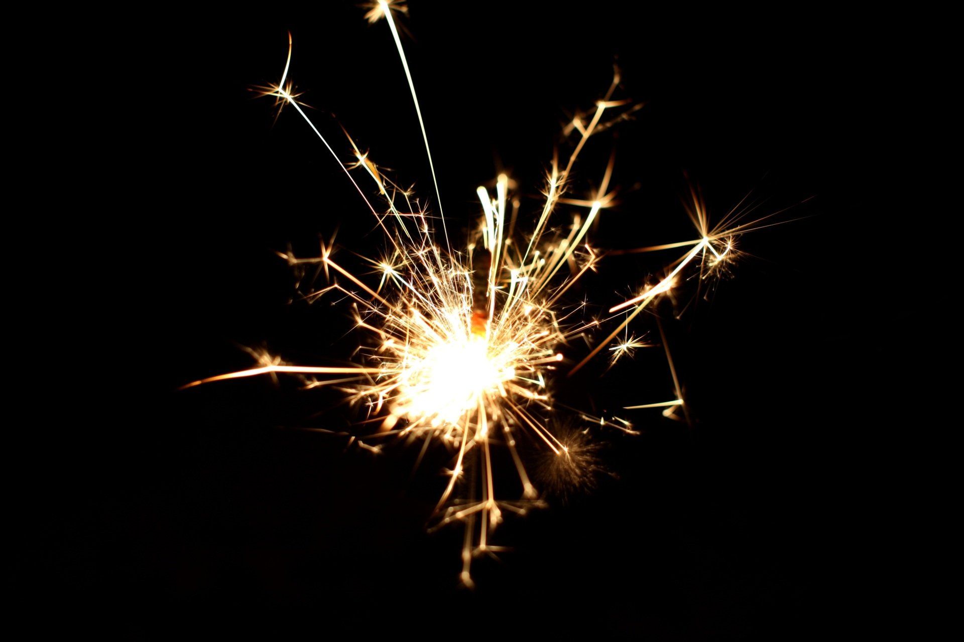 Yellow fireworks on a black background night sky