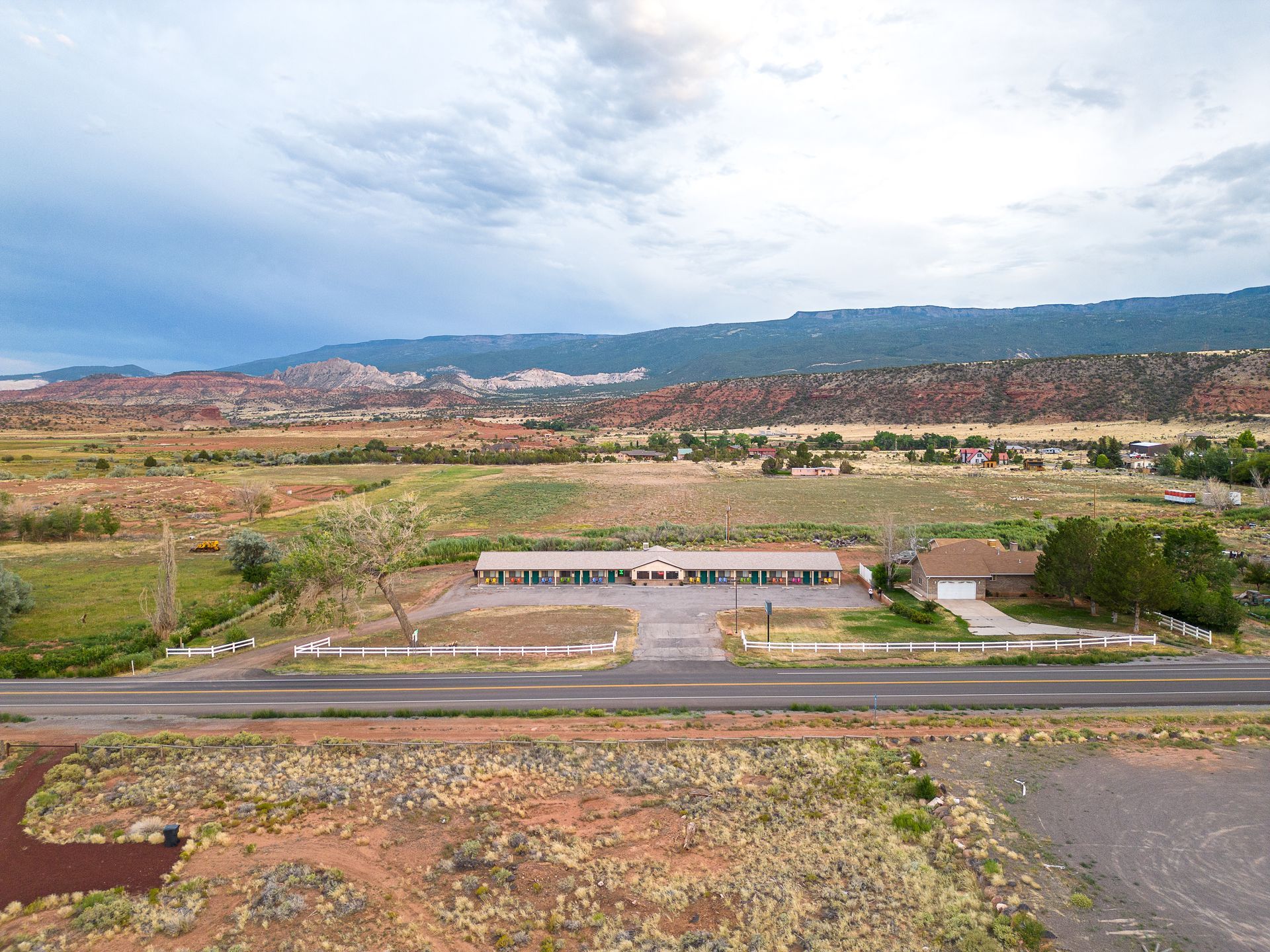 aerial of motel torrey with red rocks in the distance