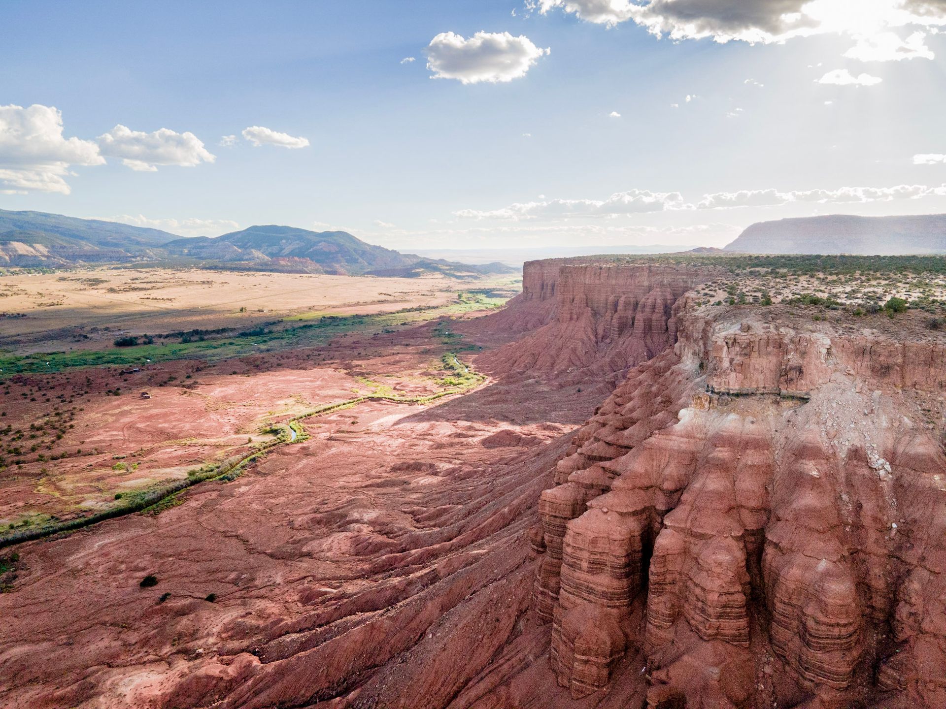red rocks overlooking a wide open valley