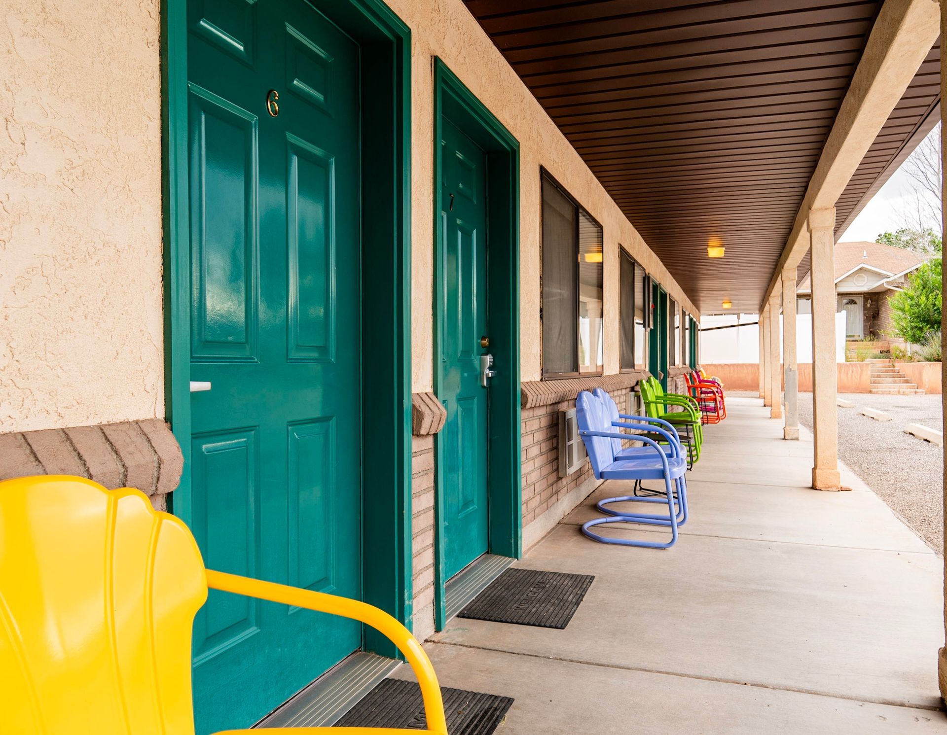 motel porch with colorful chairs
