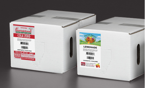 Two boxes of cola zero are sitting next to each other on a table.