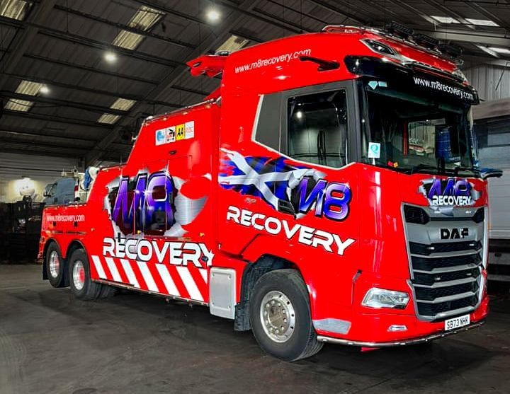 Red and white recovery truck with 