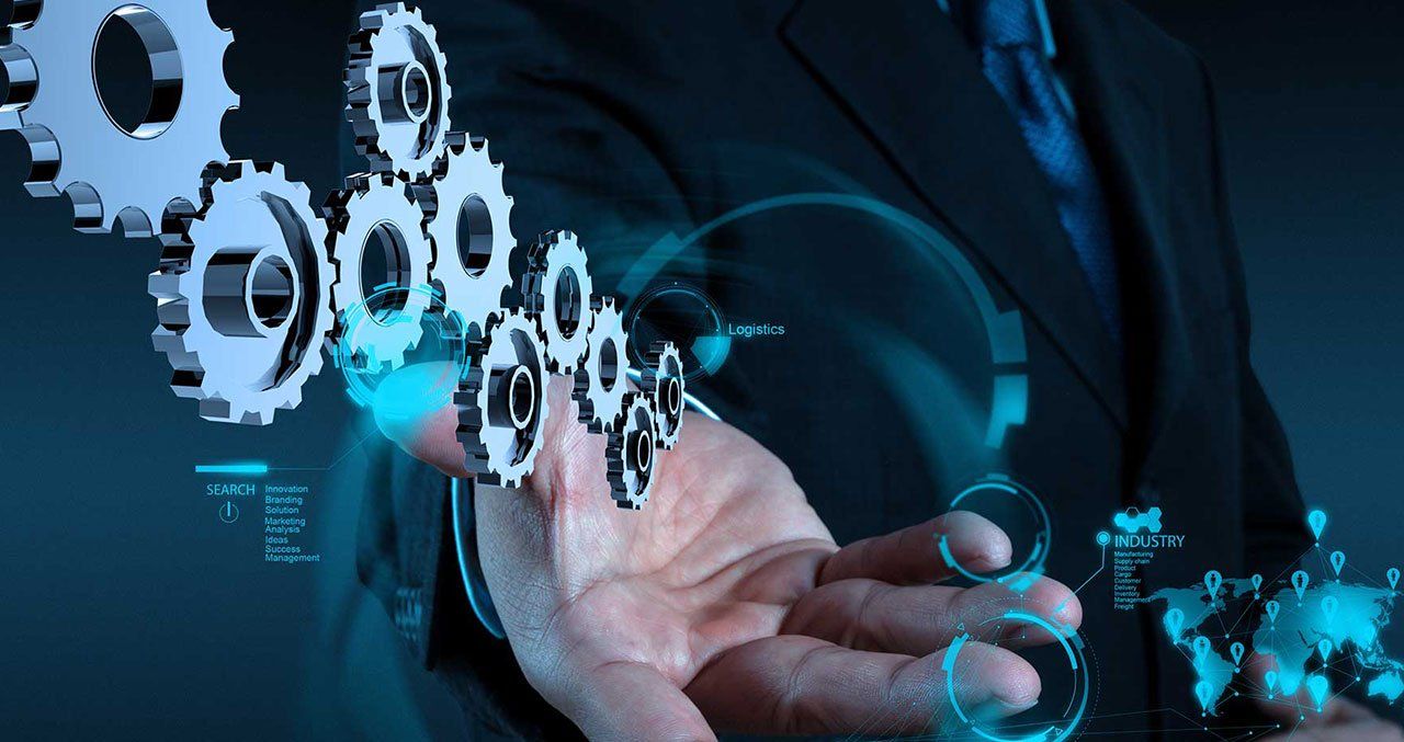 Man in suit with gears hovering above hand, with world map.