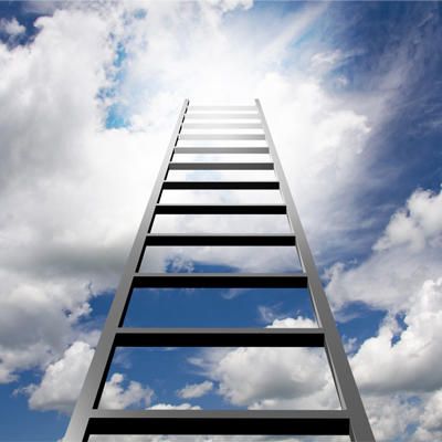 A ladder is going up into a cloudy sky