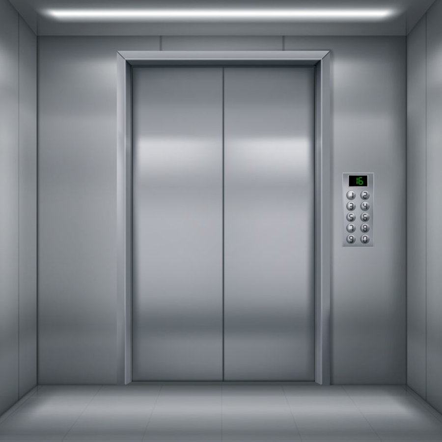 An empty elevator with the doors open and buttons on the wall.