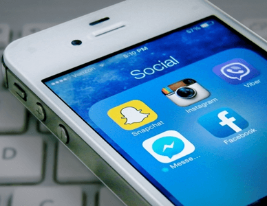 White smartphone displaying social media app icons: Snapchat, Instagram, Facebook, Messenger, and Viber.