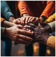 Hands of diverse individuals joined together in a pile, symbolizing unity.