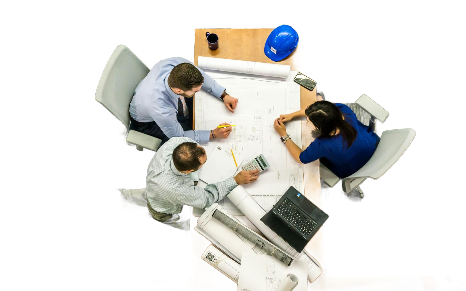 top view of people sitting at a desk planning a construction project with a construction document laid out on the table