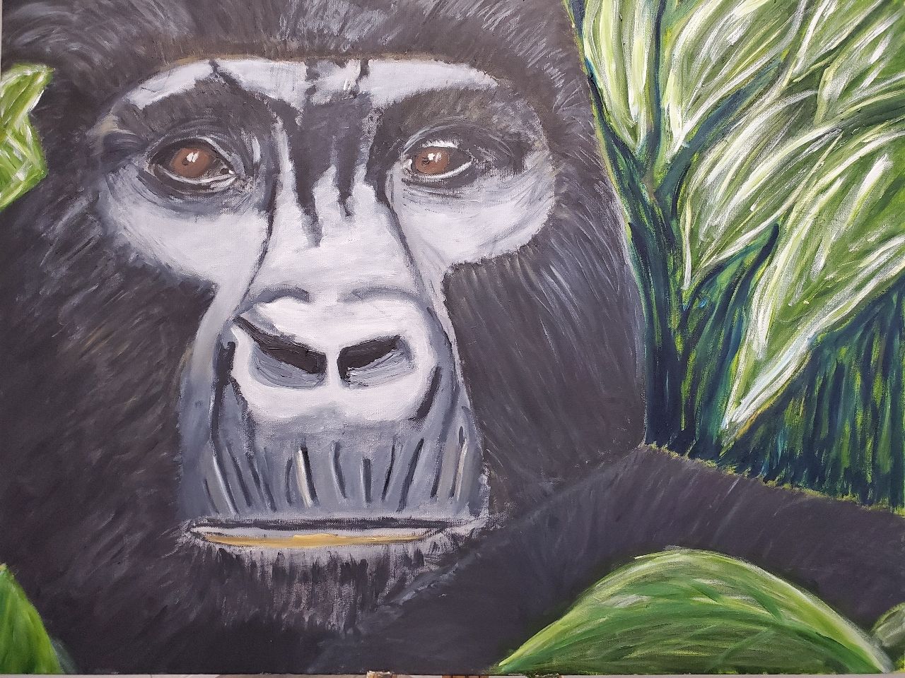 A painting of a gorilla with leaves in the background