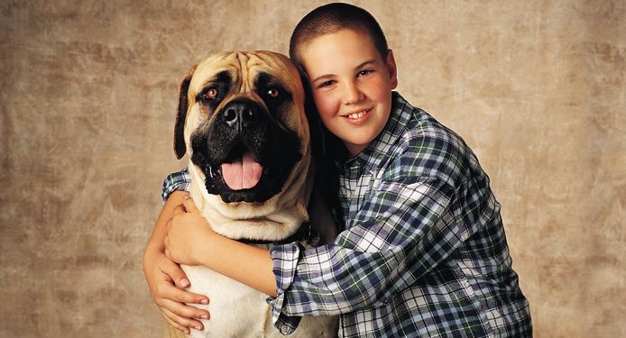 Portrait photo of a young boy and his dog