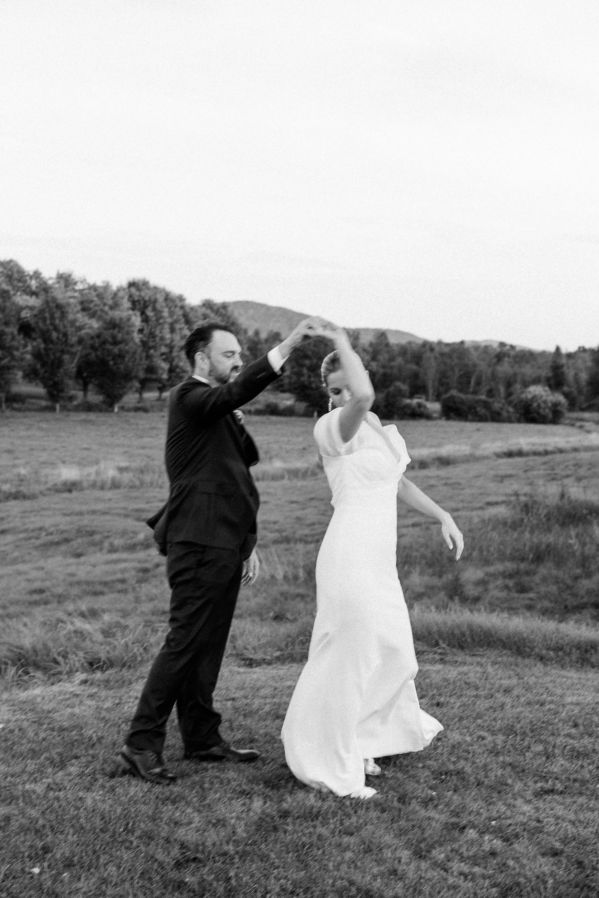 black and white photo of a happily married couple on their wedding day in front of the tree lie