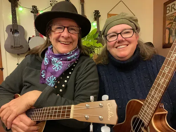 Clare and Rebecca, two musicians who perform at isham family farms.