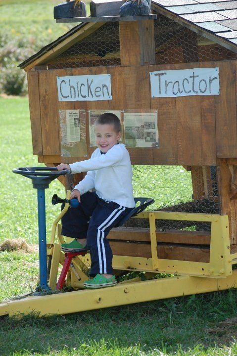 Young boy driving the chicken tractor at isham family farm in vermont