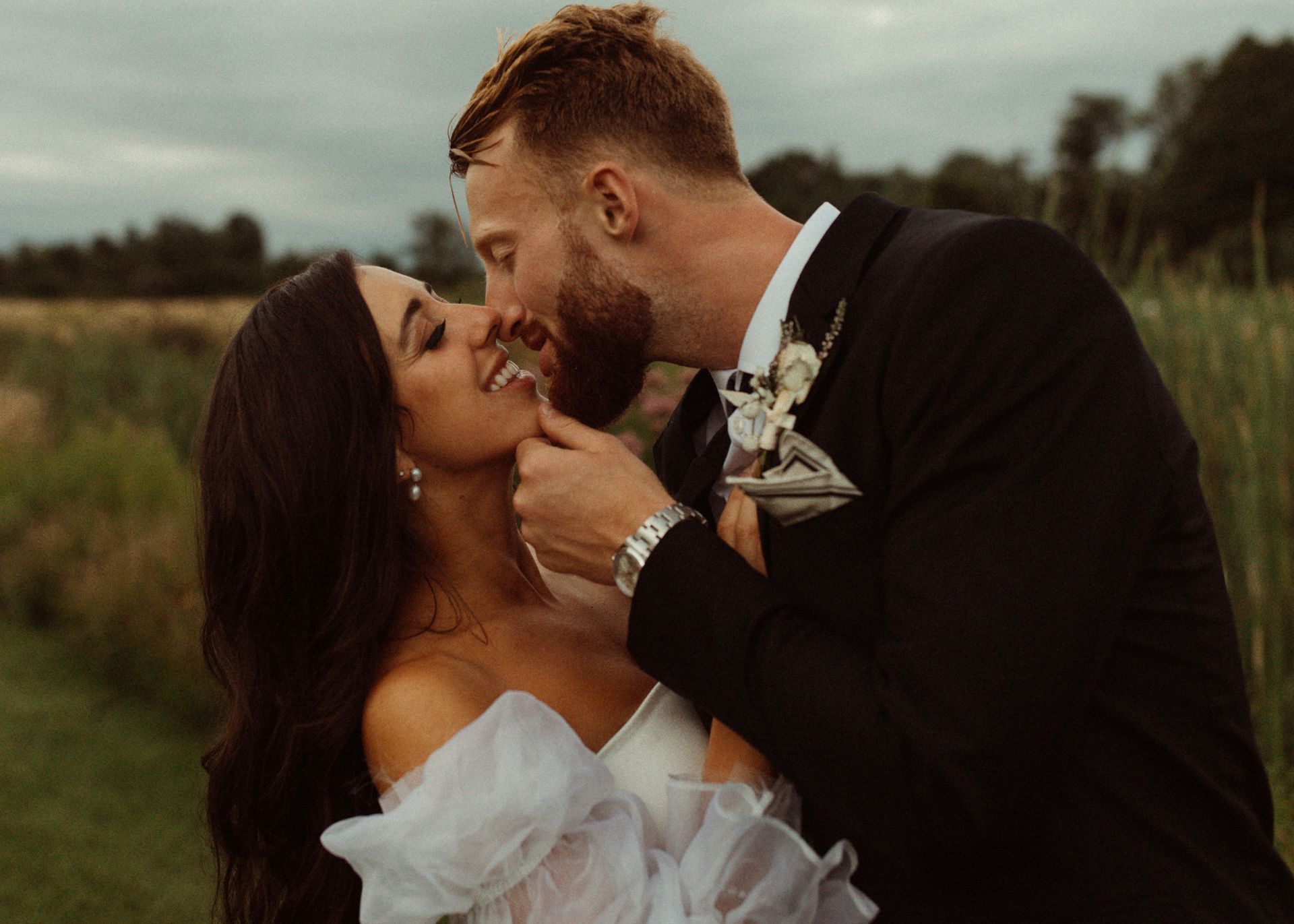 up close shot of newlywed couple kissing just after their ceremony at isham family farm in vermont