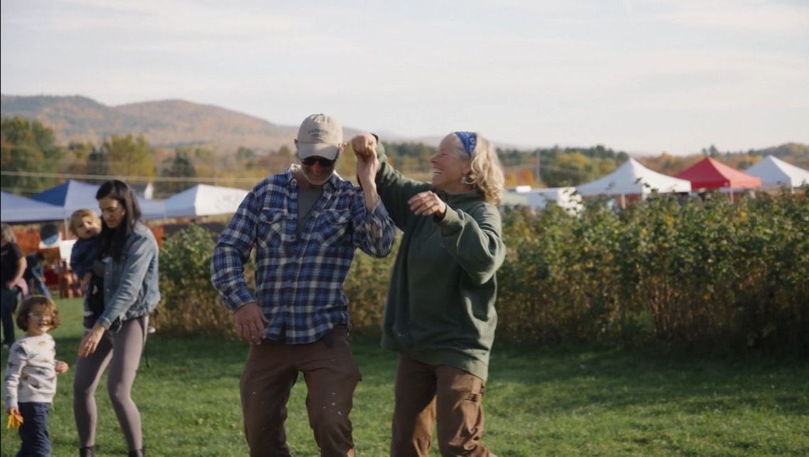 David and Helen isham dancing at dusk during the annual fall festival at Isham family farm 
