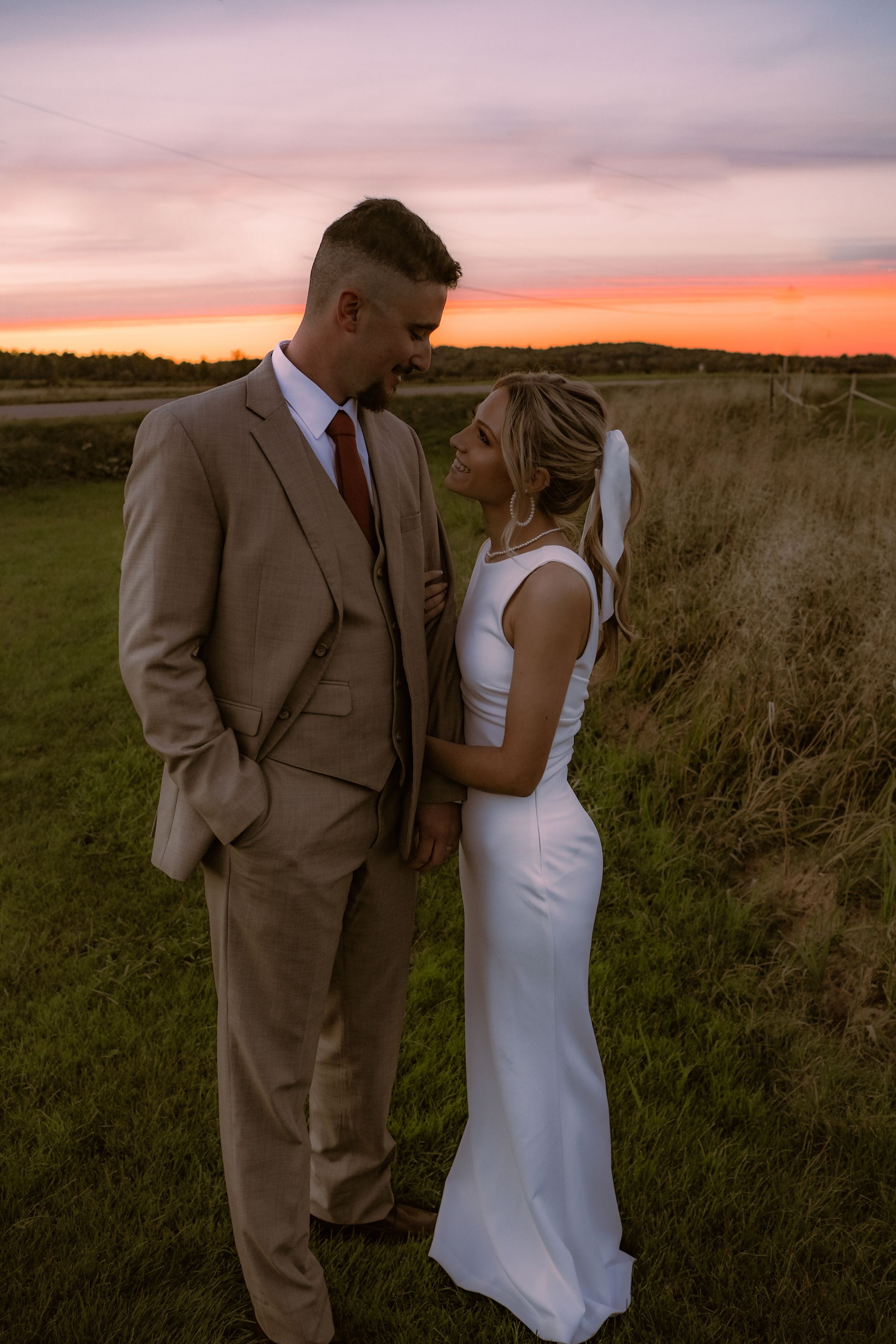 newlyweds smiling at each other after their ceremony at isham family farm