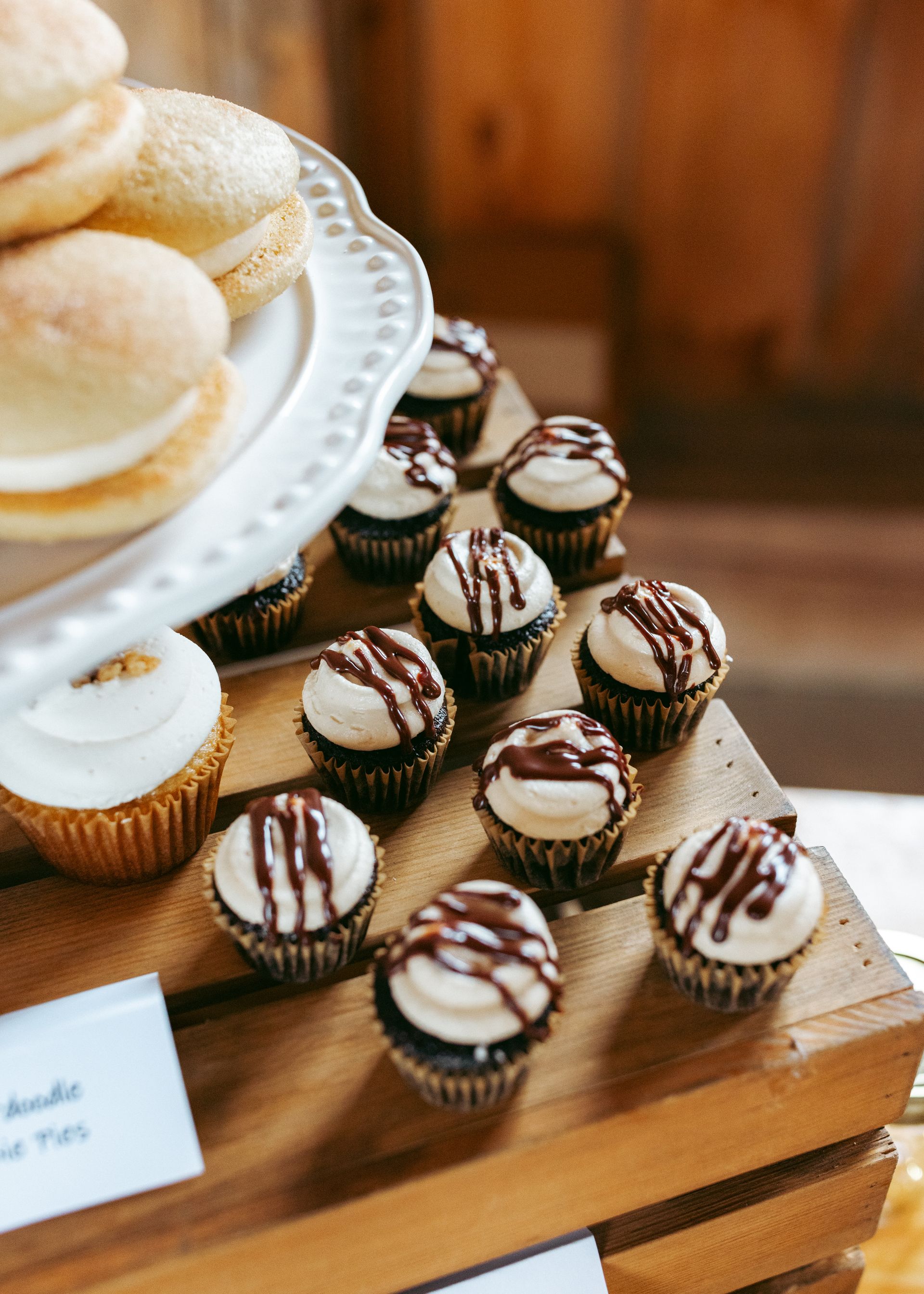 up close photo of a cupcake display at a wedding reception held at isham family farm in vermont