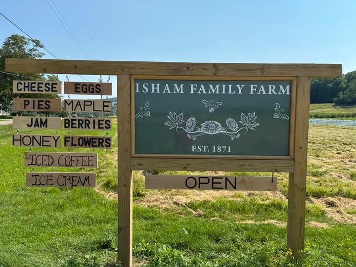 isham family farm welcome sign with all the offerings available