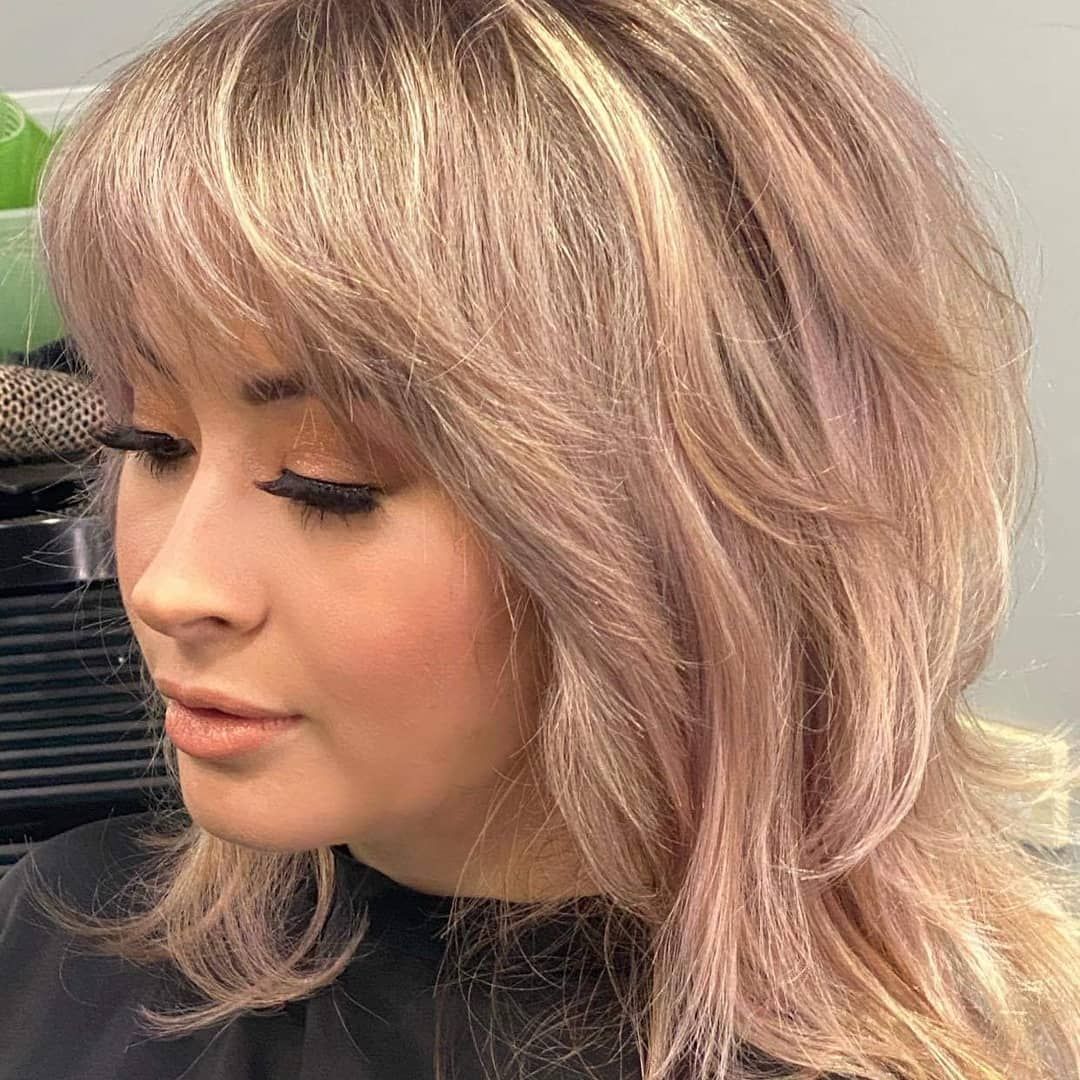 A Woman With Pink Curly Hair Is Wearing A Striped Shirt — MLB Hair In  Smithfield, QLD