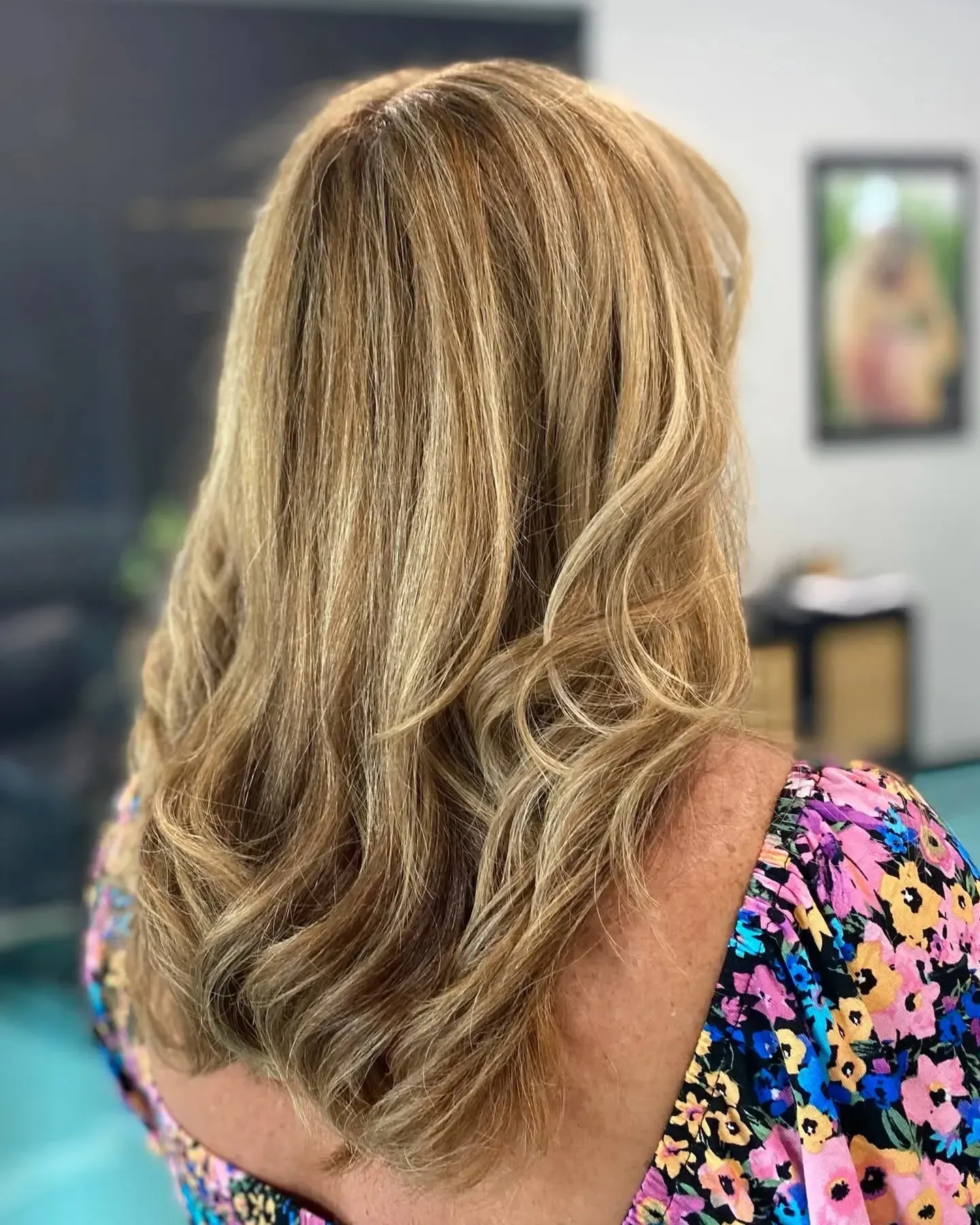 A Woman With Blonde And Purple Hair Is Sitting In A Chair — MLB Hair In  Smithfield, QLD