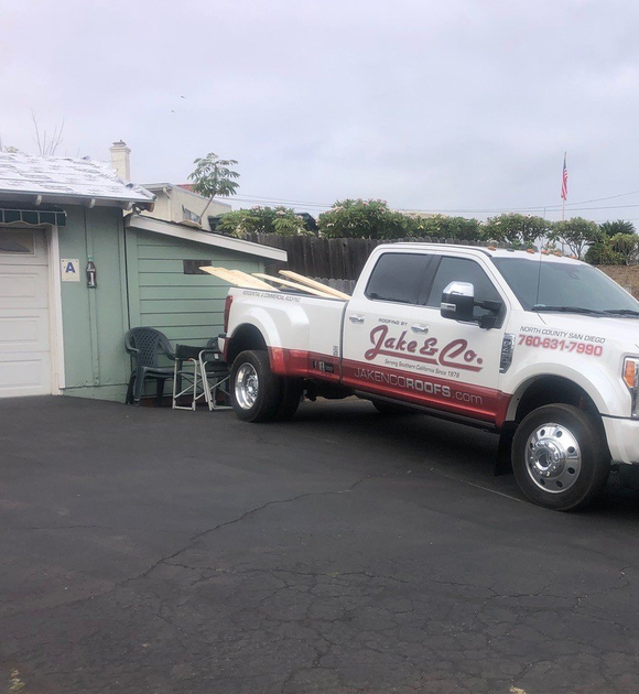 Roofer on a Building — Vista, CA — Jake & Co.