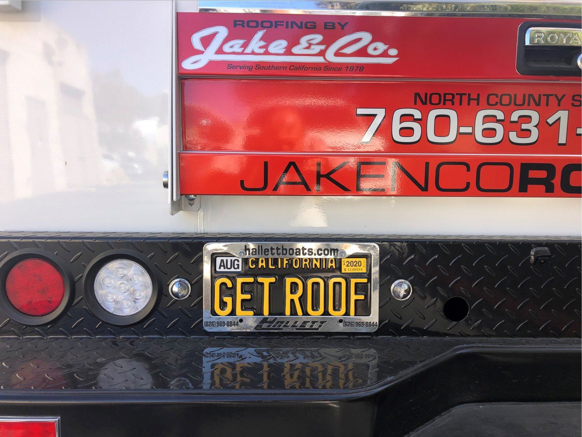 A truck with a california license plate that says get roof