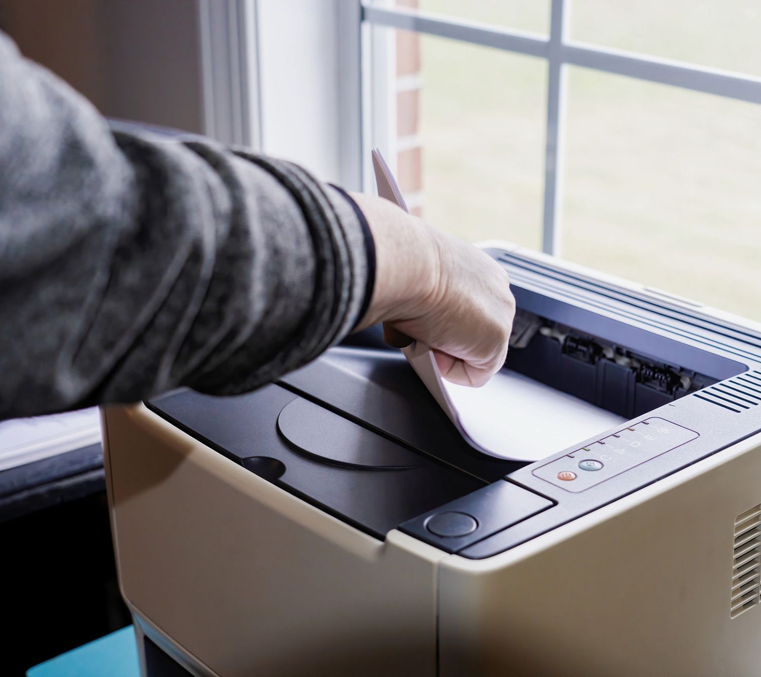 A Person Printing a Documents — Lancaster, PA — Knight's Copier Sales & Service