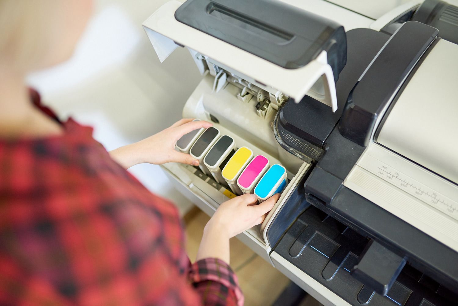 Woman Taking a Cartridge Out of a Printer — Lancaster, PA — Knight's Copier Sales & Service