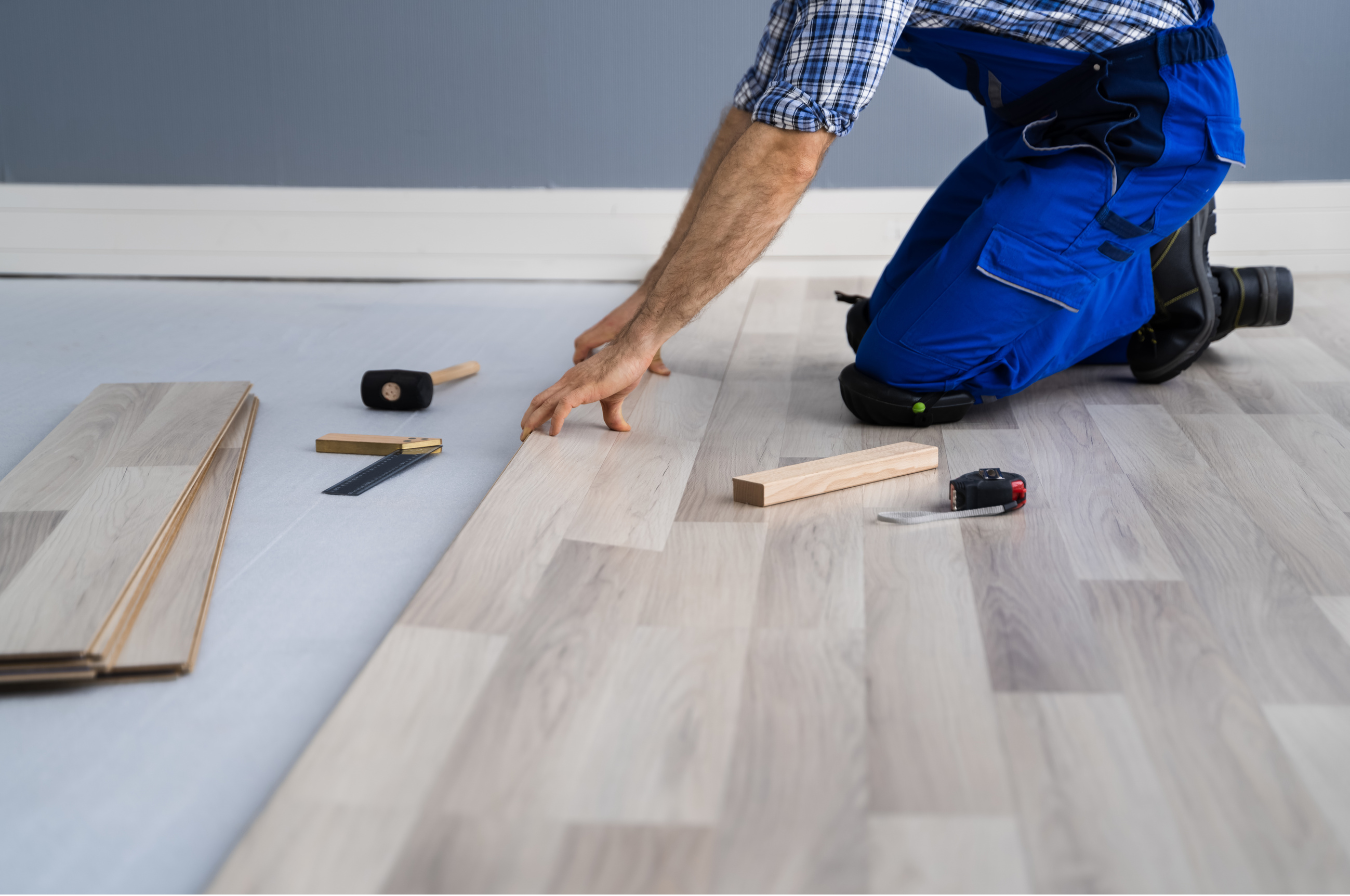 man installing laminate floors