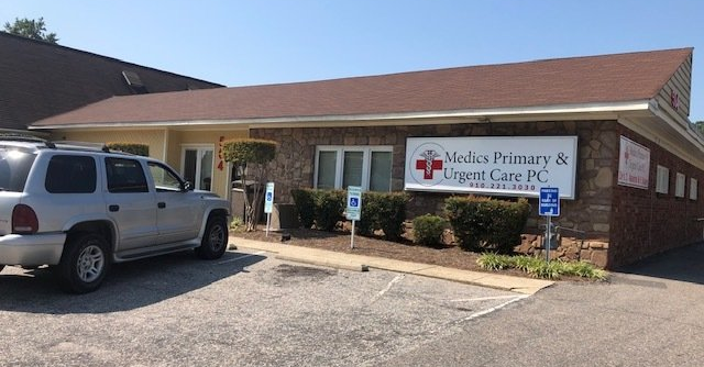 Urgent Care — Nurse Holding Patient Record in Fayetteville, NC