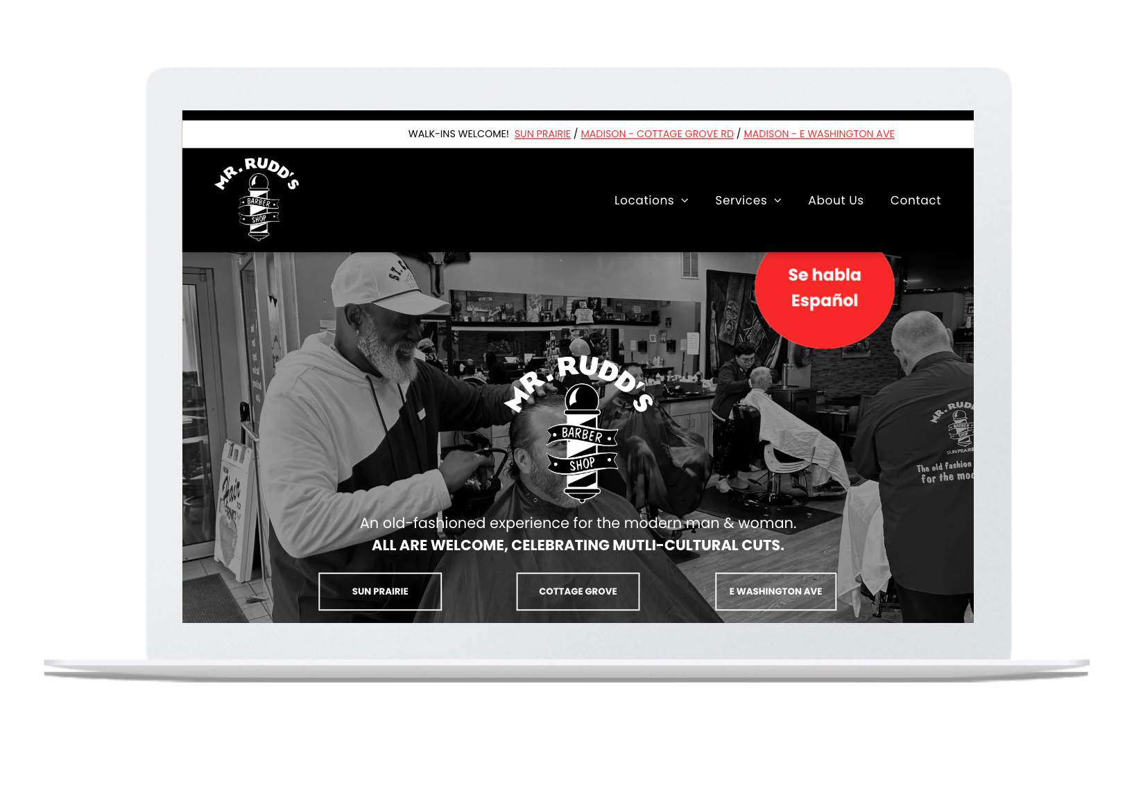 A man is getting his hair cut at a barber shop on a laptop.