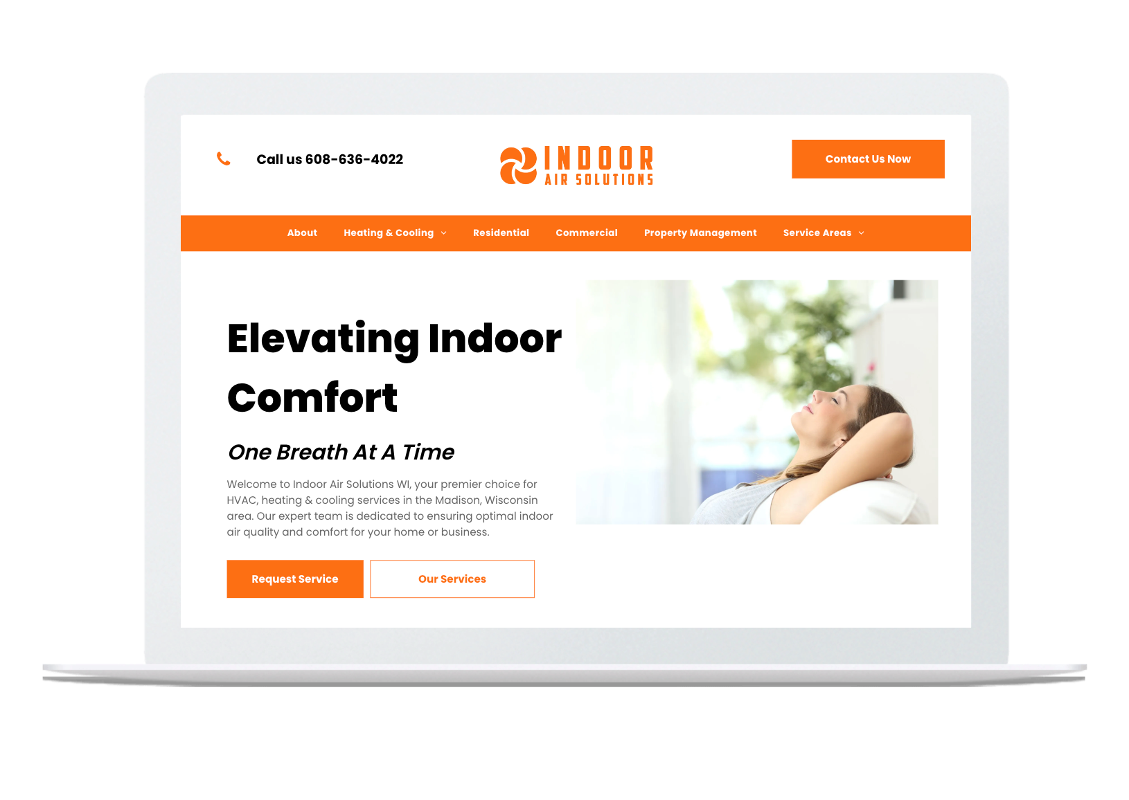 A laptop computer is displaying a website for elevating indoor comfort.