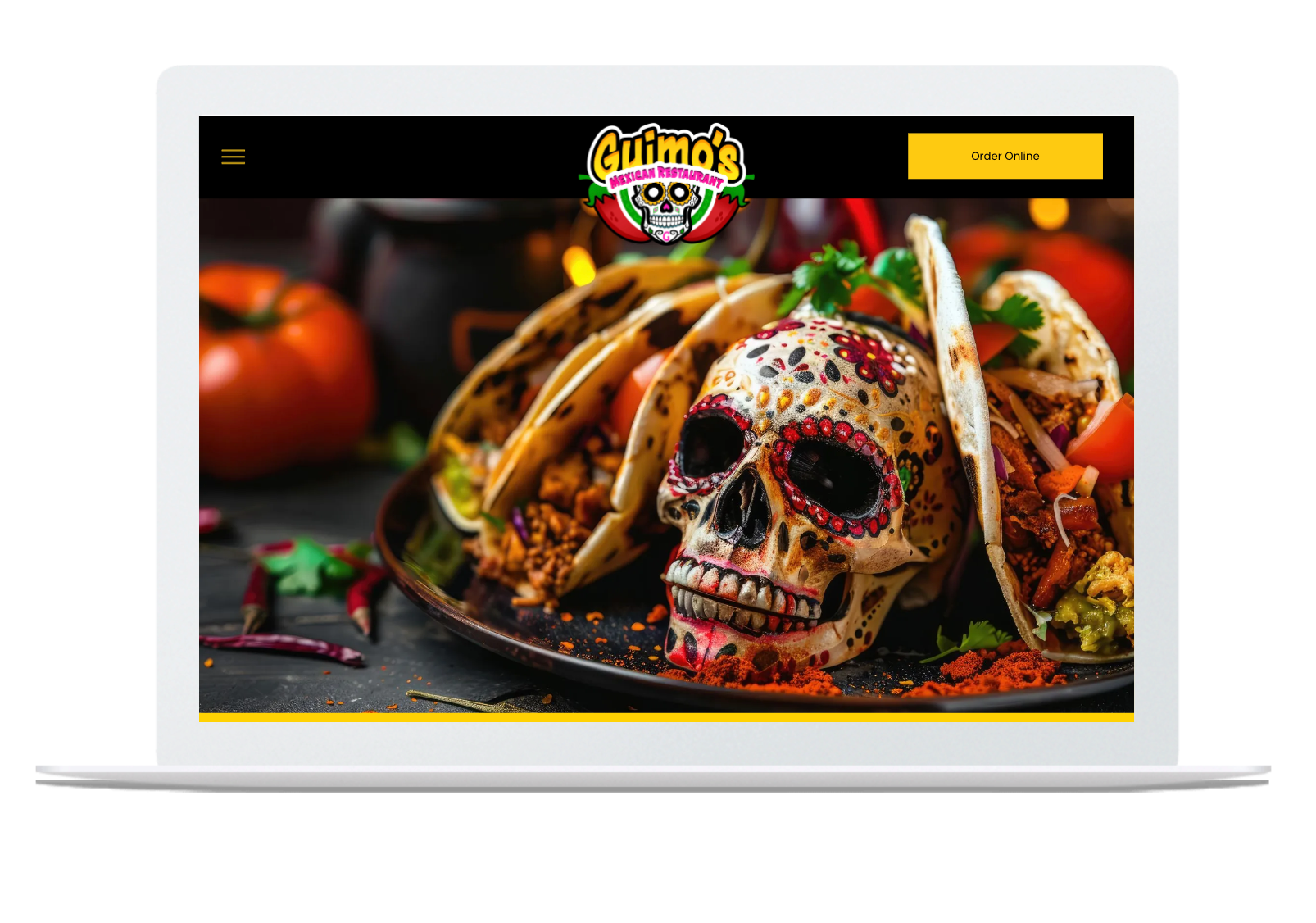A laptop screen shows a plate of food with a skull on it.