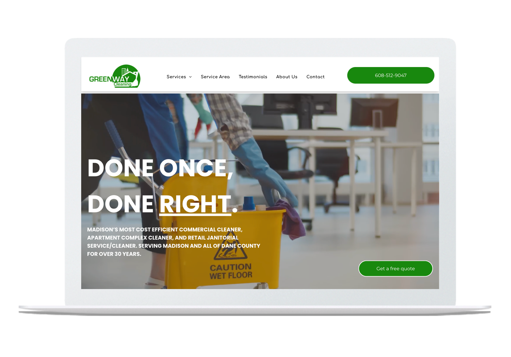 A laptop screen shows a cleaning company website.