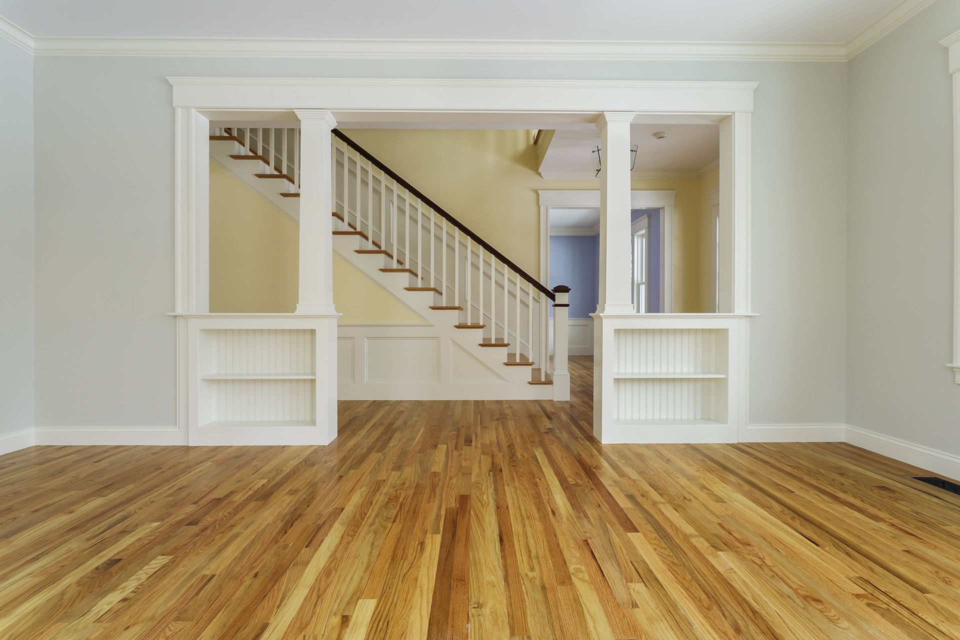 Unfurnished home interior with hardwood flooring.