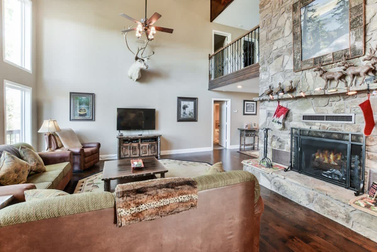A living room filled with furniture and a fireplace.