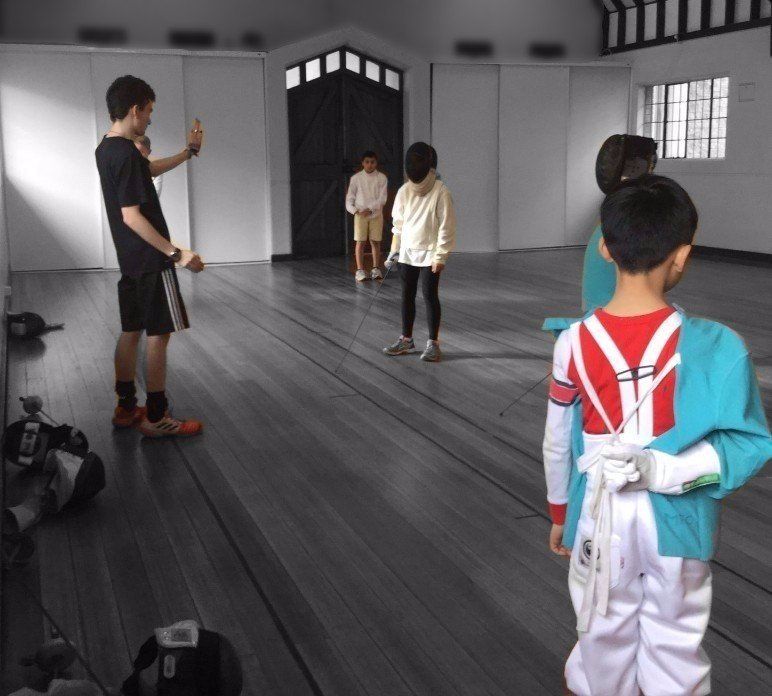 children fencing group session Musketeers