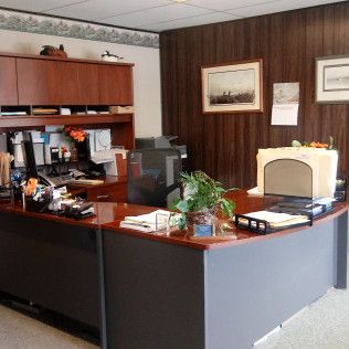 An office with a desk and a computer on it