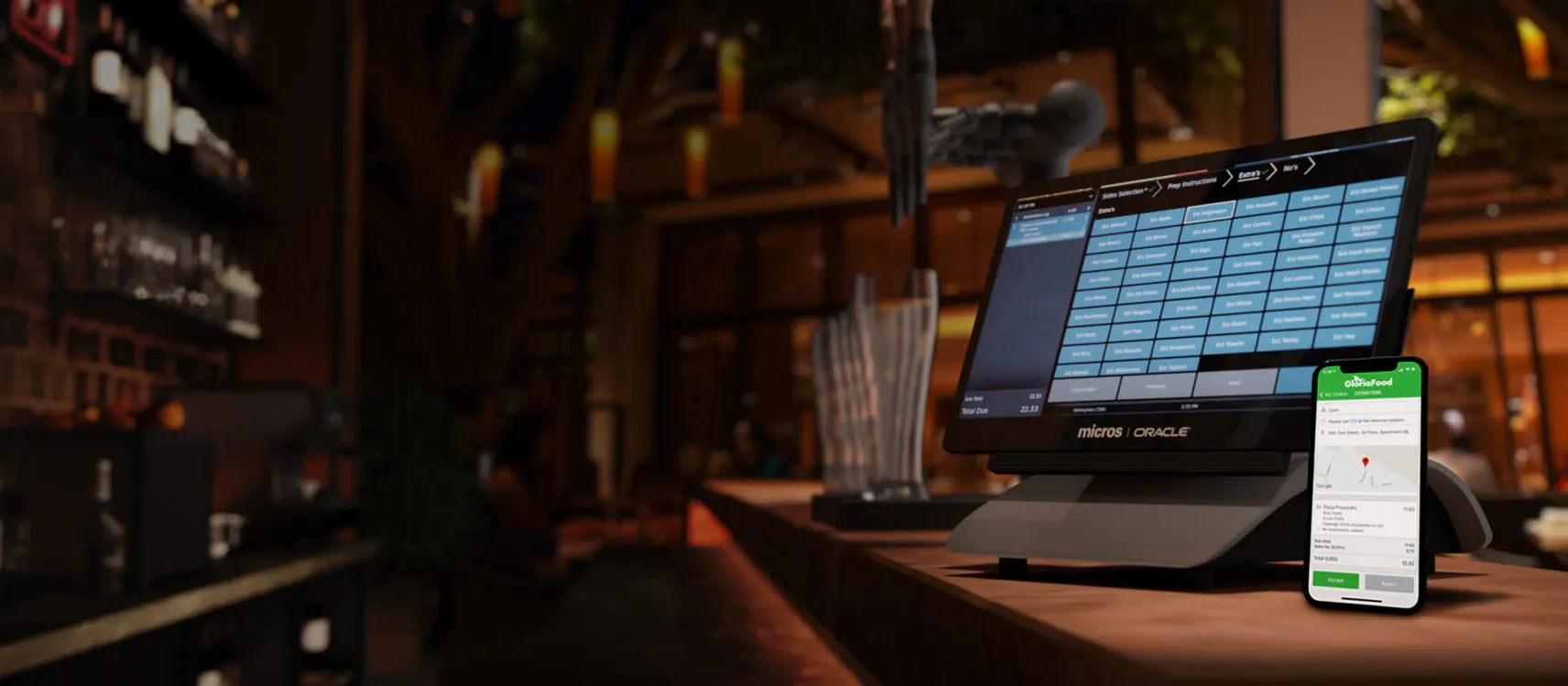 Ein Kassensystem mit Mobiltelefon auf einem Tresen in einem Restaurant.