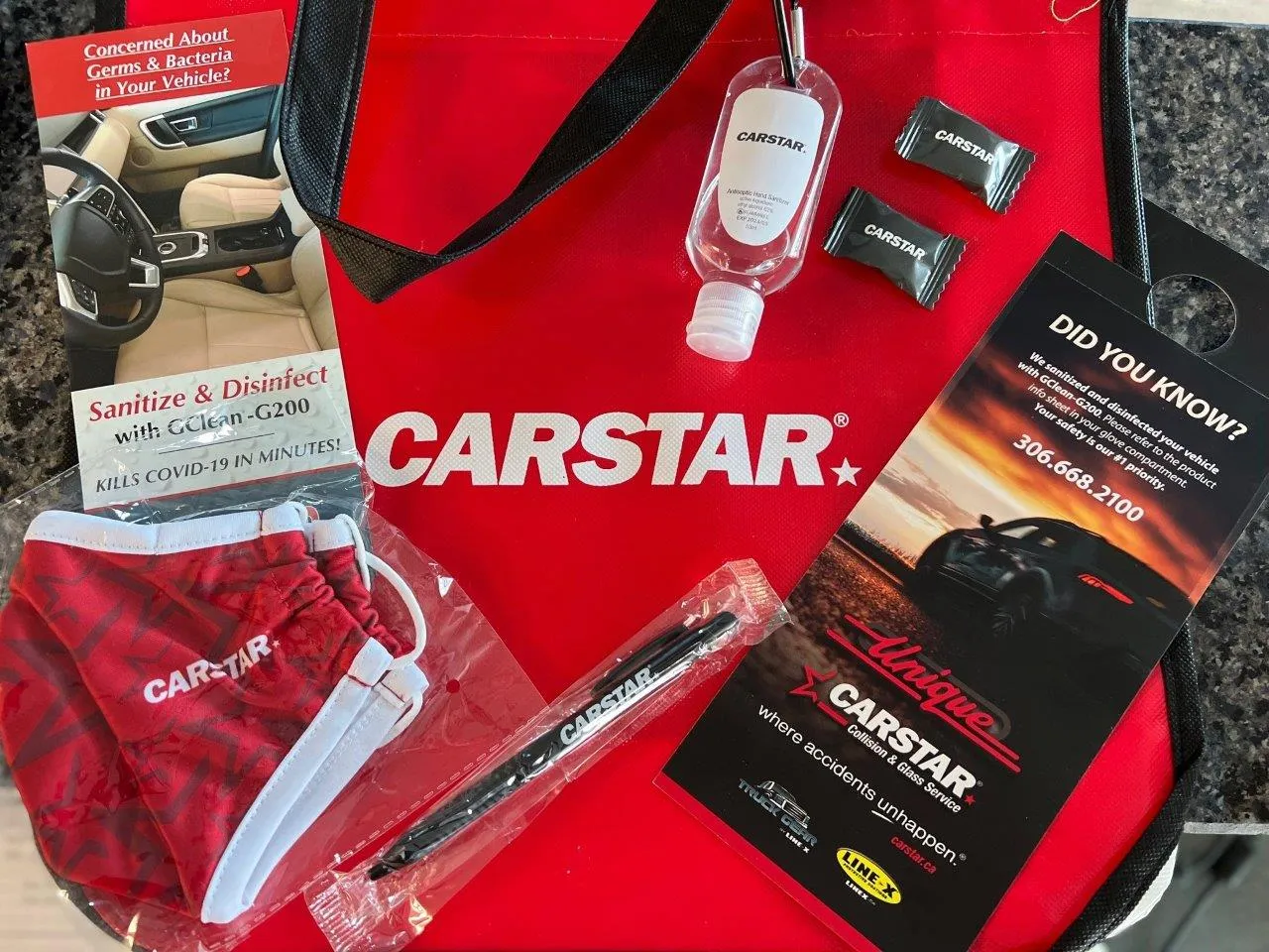 A red bag with carstar written on it