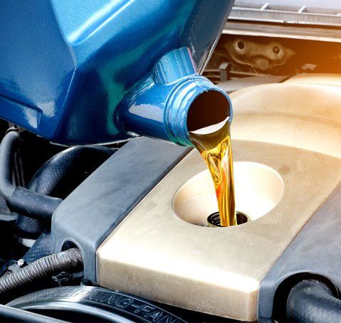 Pouring Quality Engine Oil — Riverdale, IL — L&T Auto Repairs