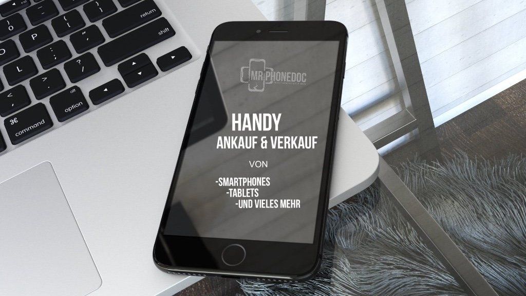 Handy liegt auf einen Laptop und es wird gezeigt das ein an und verkauf hier gibts