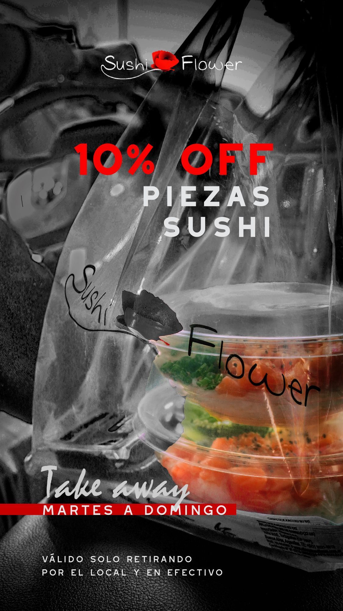 A black and white photo of a person holding a bag of sushi.