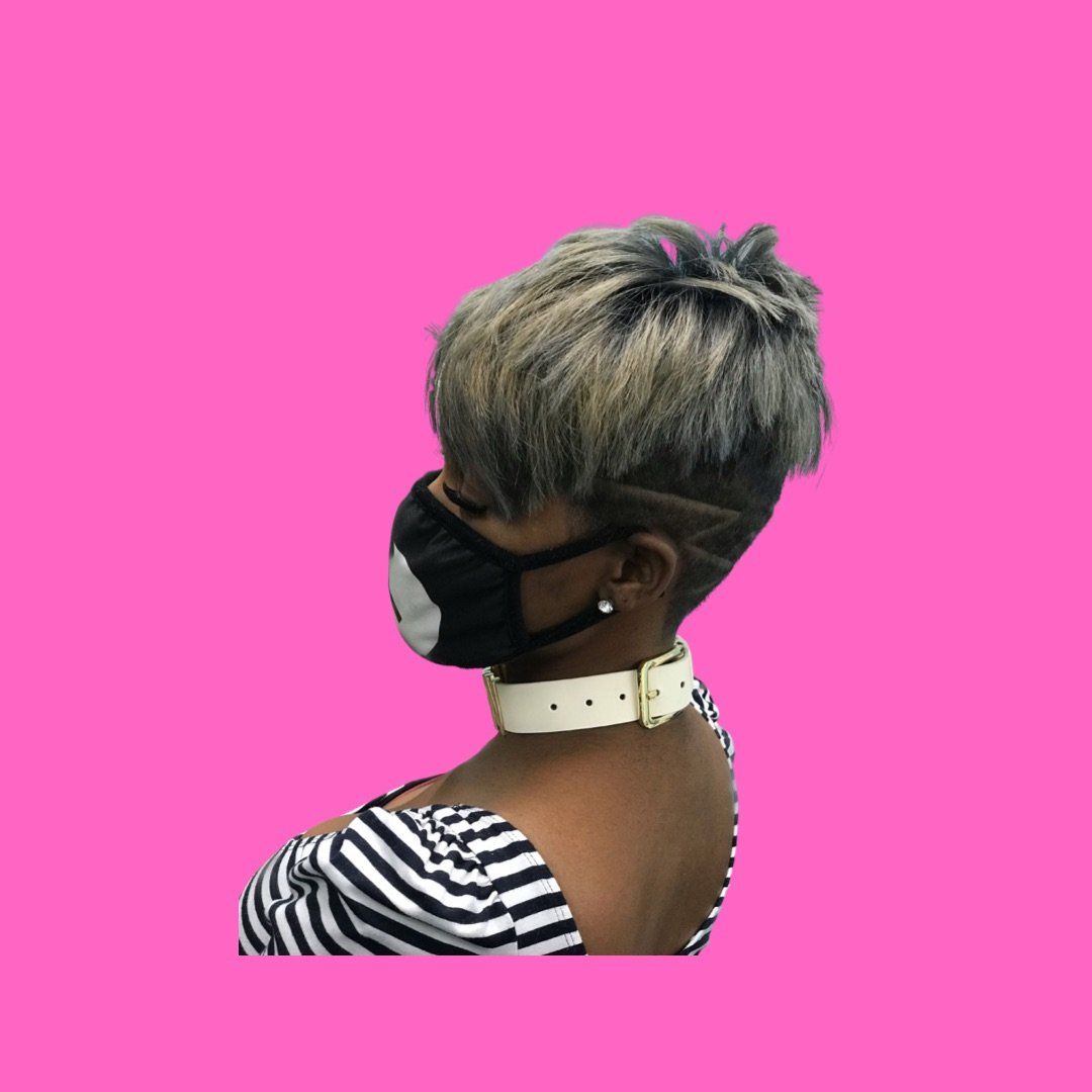 A woman with a silver pixie haircut