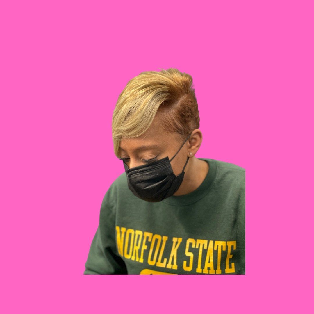 A woman with a blonde pixie haircut